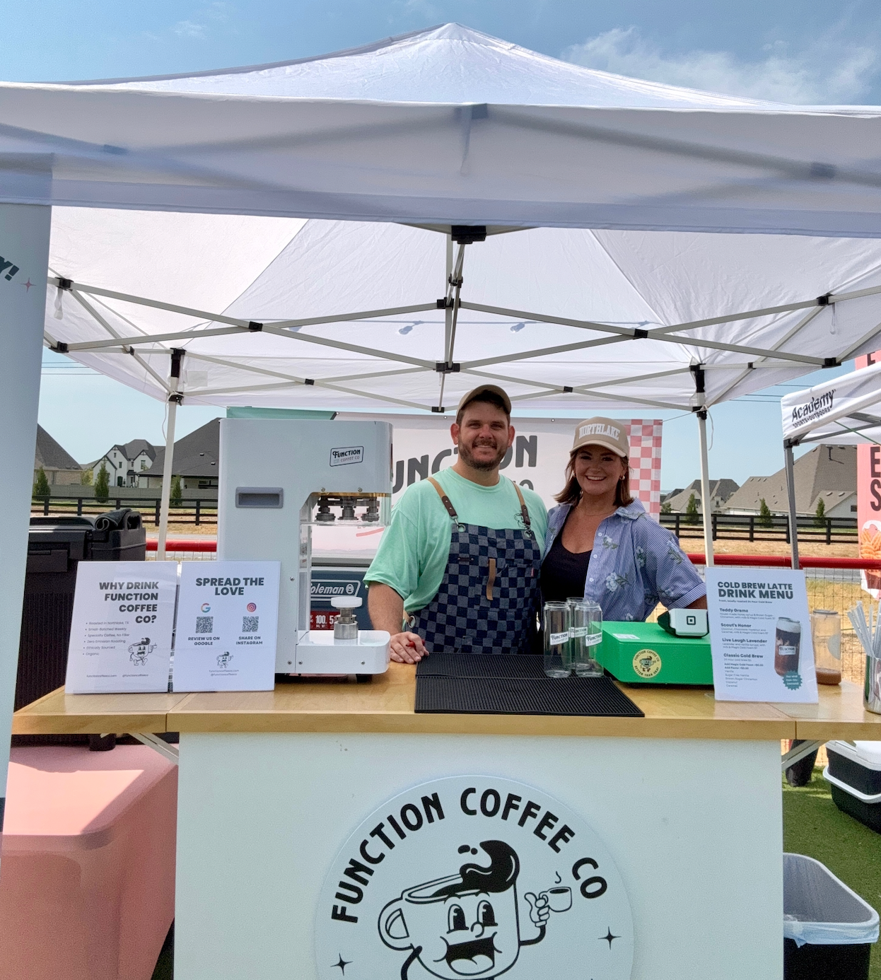 tony and devin daussat owners of Function Coffee Co behind their coffee cart pop up