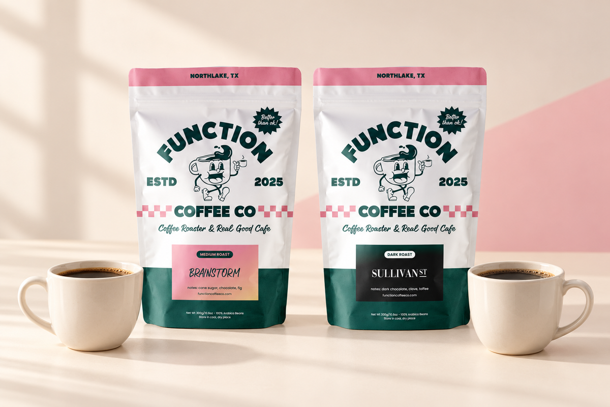 Function Coffee Co. Brainstorm medium roast and Sullivan St. dark roast coffee bags beside two cups of coffee.